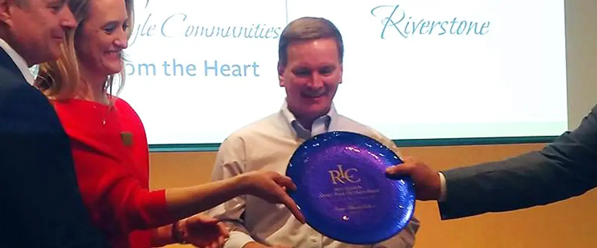 Manager winning 'From the Heart' Award at Riverstone.