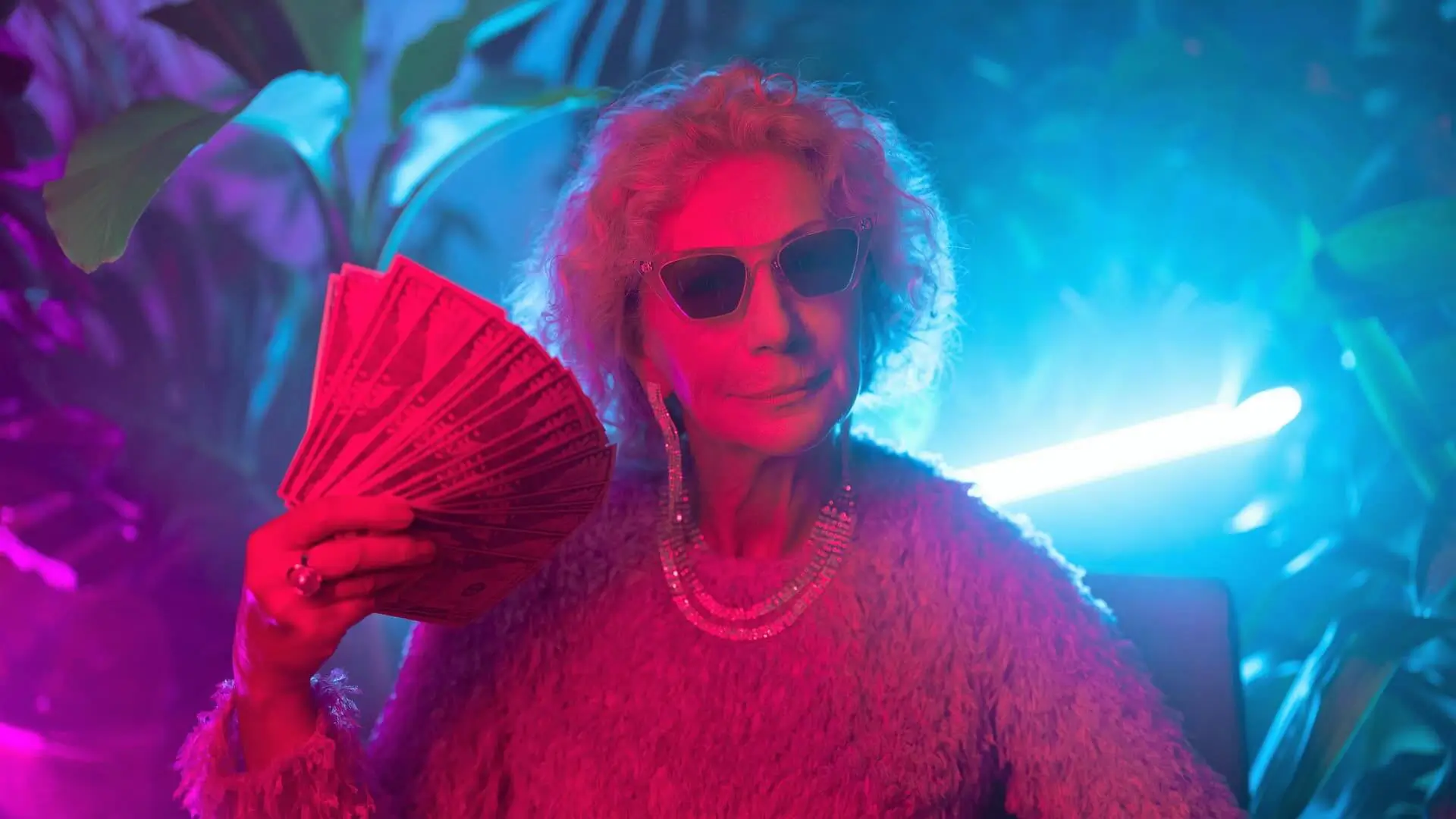 Photo of an Elderly Woman Flaunting Money