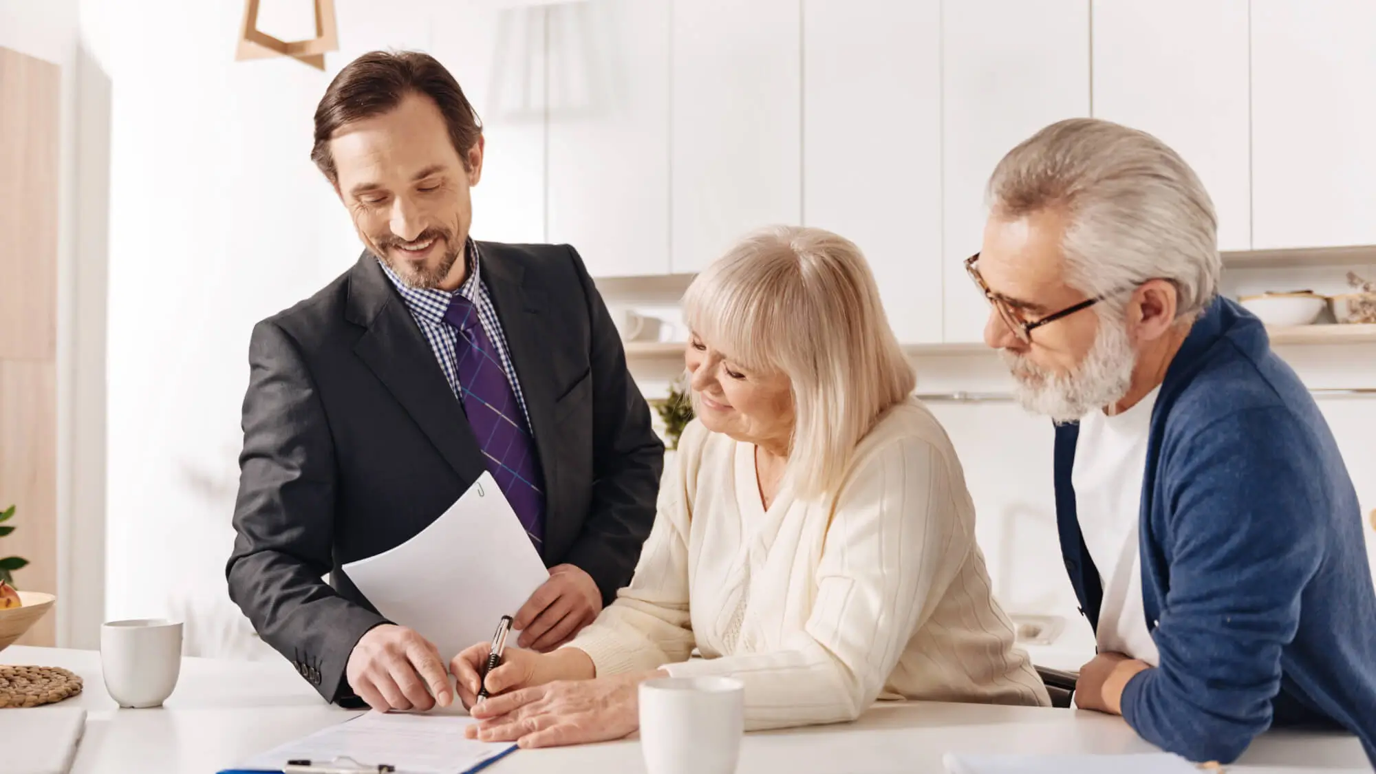 seniors meeting with attorney to review essential legal documents