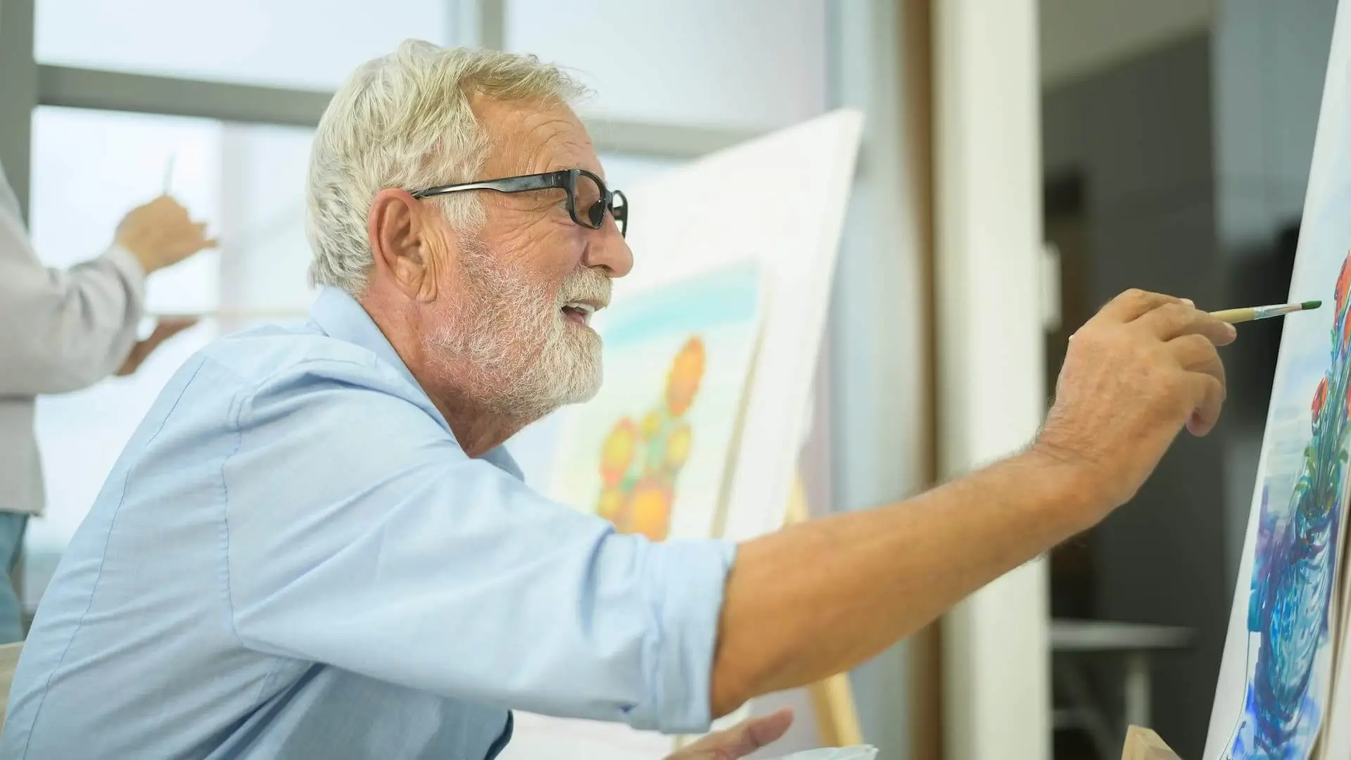 Senior caucasian couple painting and relaxing at home