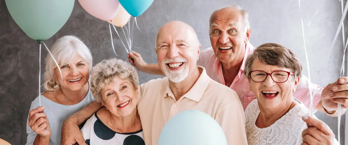 Seniors celebrating a Resort Lifestyle Communities community Grand Opening.