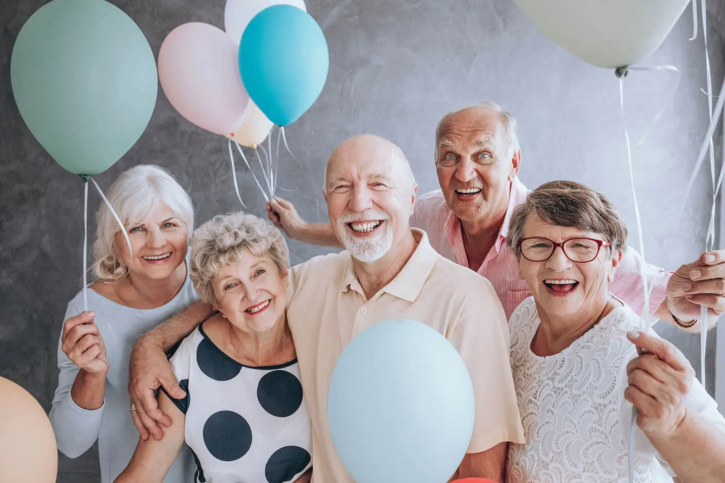 Seniors celebrating the grand opening of a community of Resort Lifestyle Communities