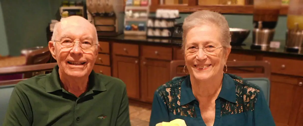 Happy senior couple enjoying breakfast together