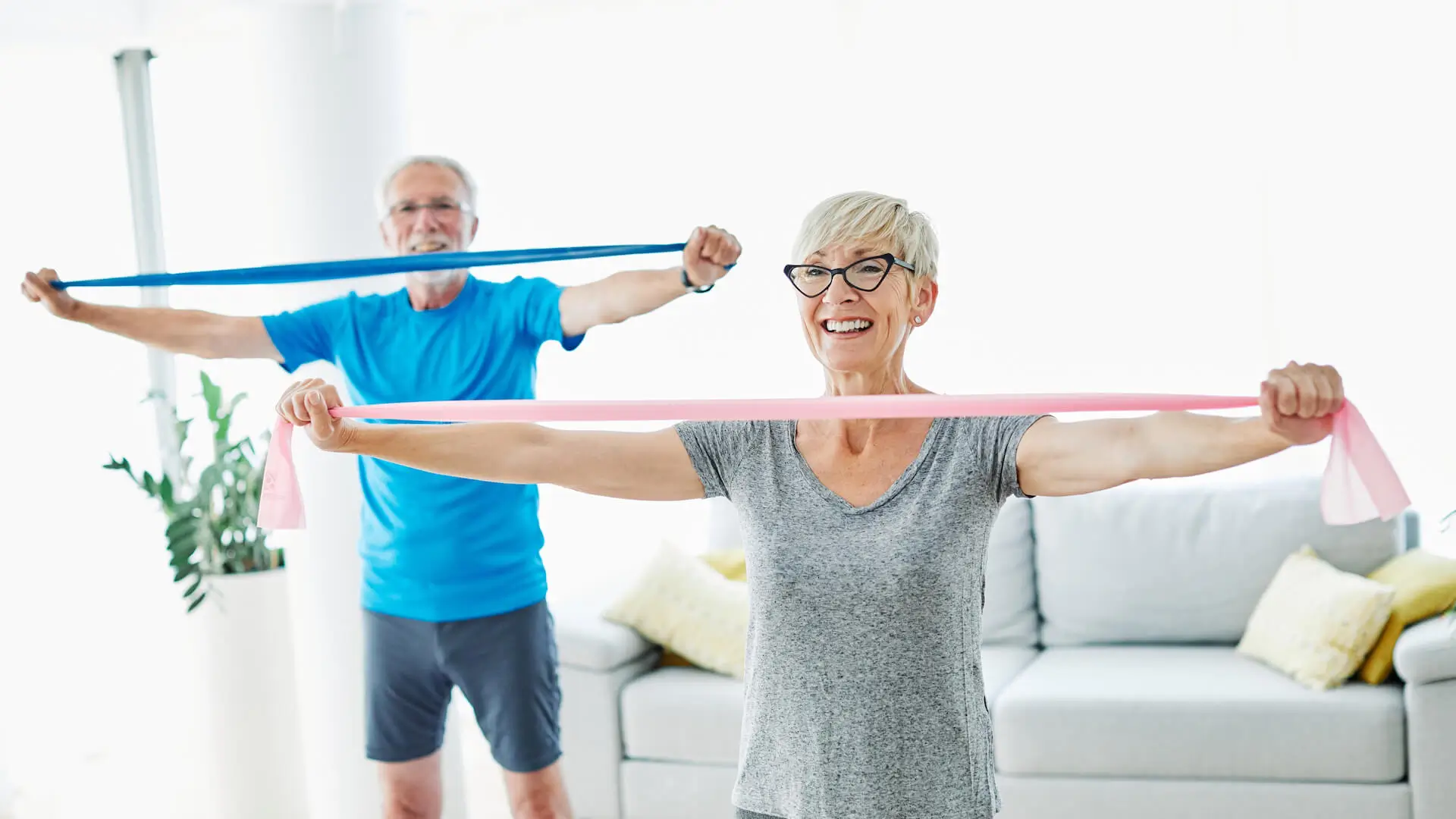 Senior couple exercise together at home health care