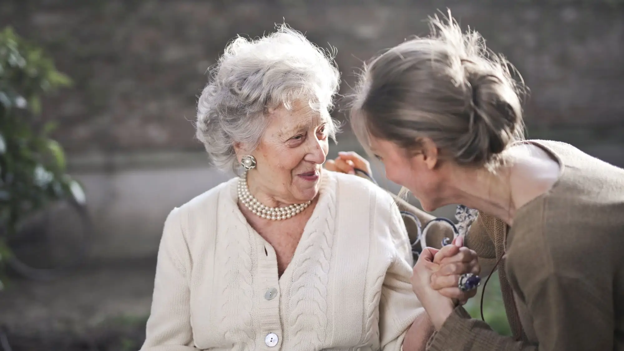 Daughter with elderly senior mother