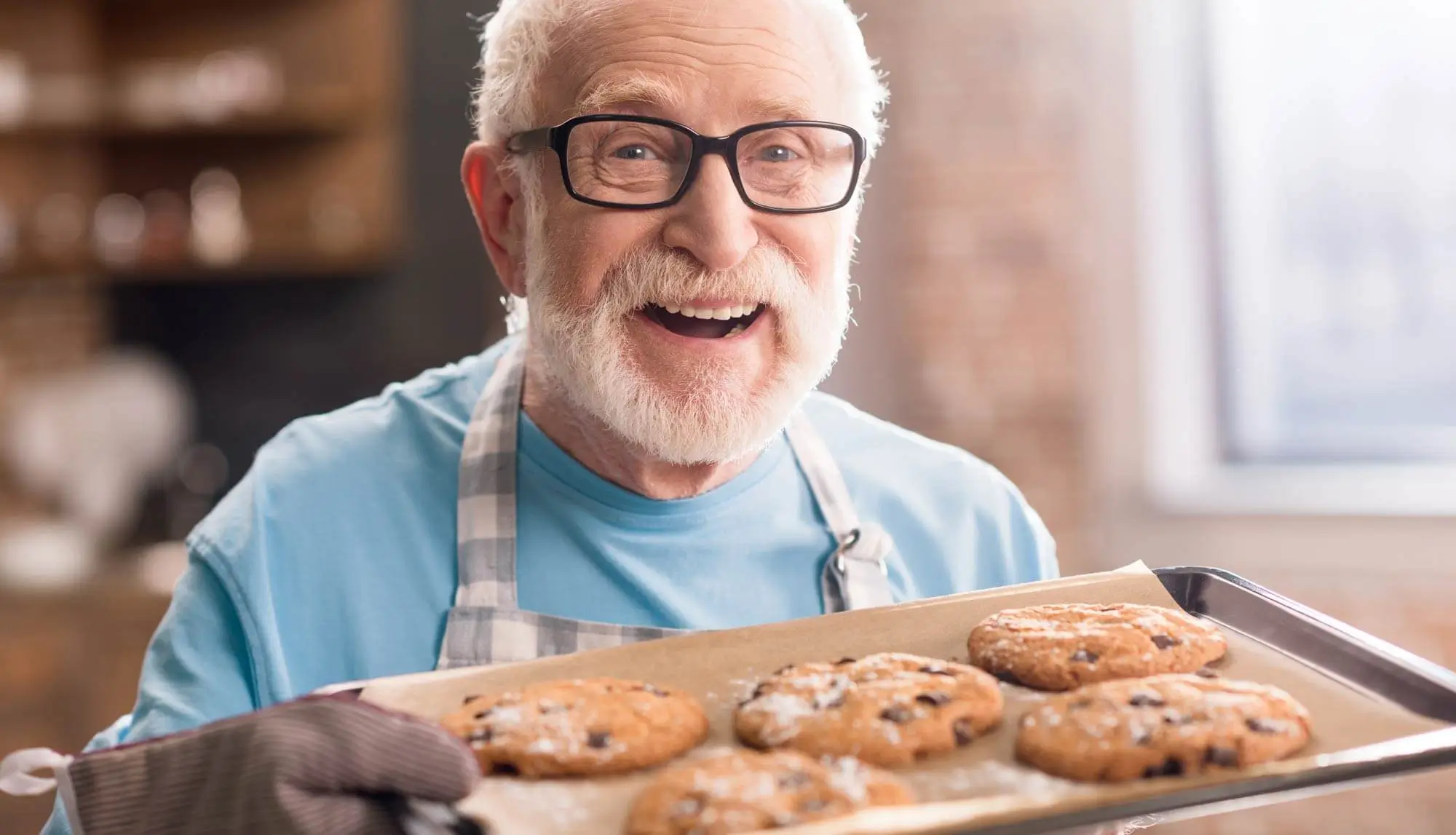 Senior displaying his baked cookies