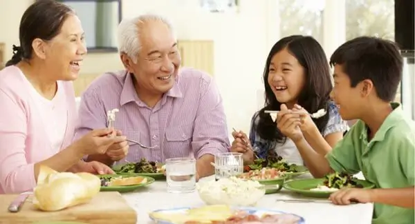 Asian family eating together