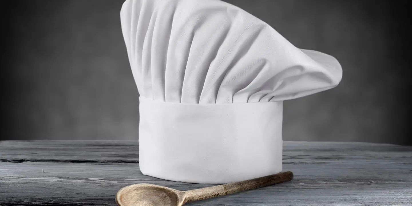 A hat and serving spoon to represent the culinary team.