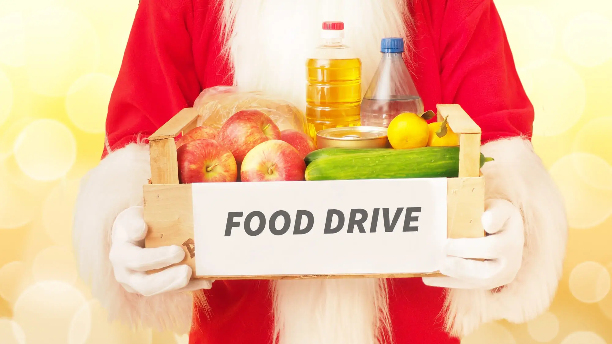 Santa Claus and a box with food. Christmas donation concept