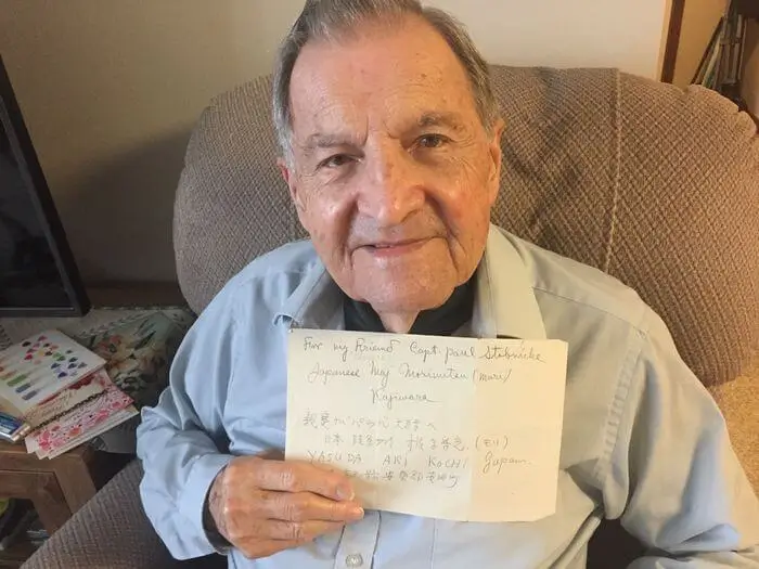 Dr. Paul Stobnicke, 96, holds a note he received from a former Japanese officer he befriended on Formosa (now Taiwan) just after World War II ended. Stobnicke lives at Towne Center Retirement Community in Fayetteville.