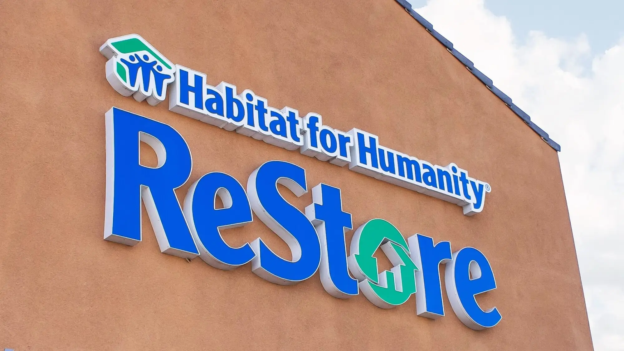 A store front sign for the home improvement thrift store chain known as Habitat for Humanity ReStore