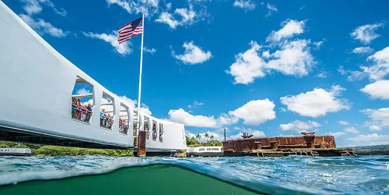 People looking at the Pearl Harbor Memorial